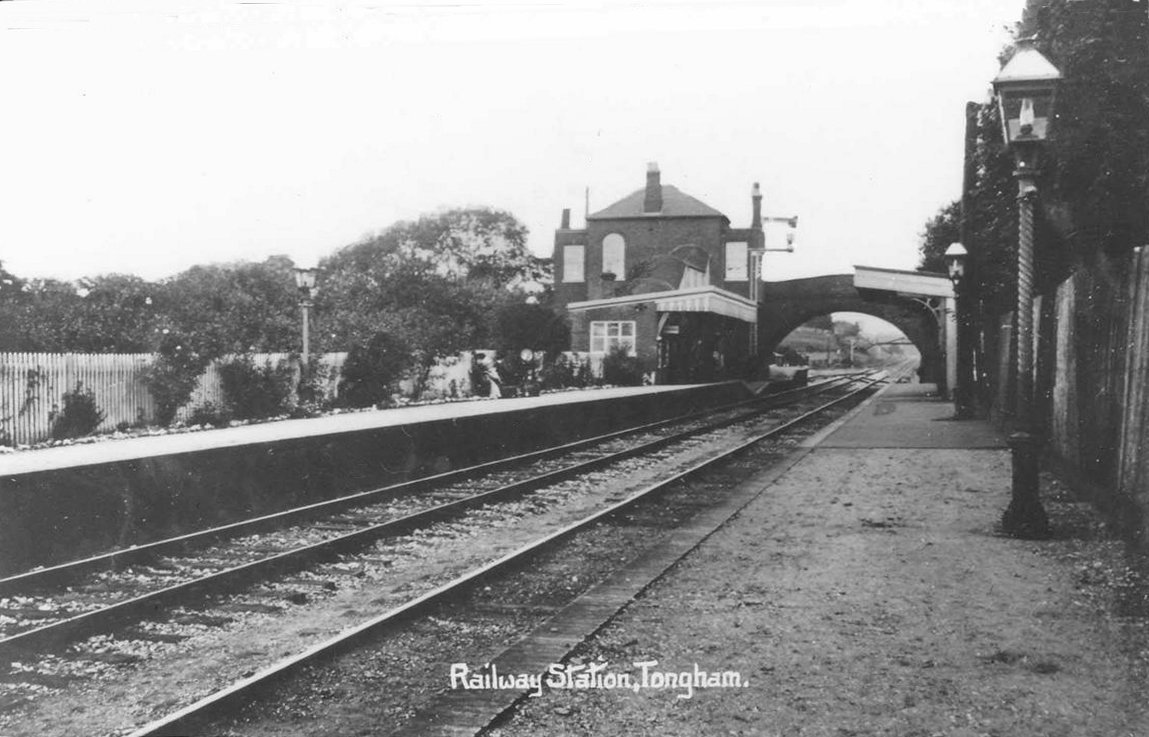 Tongham railway station, Surrey, around 1905, with railway tracks, platform and road bridge